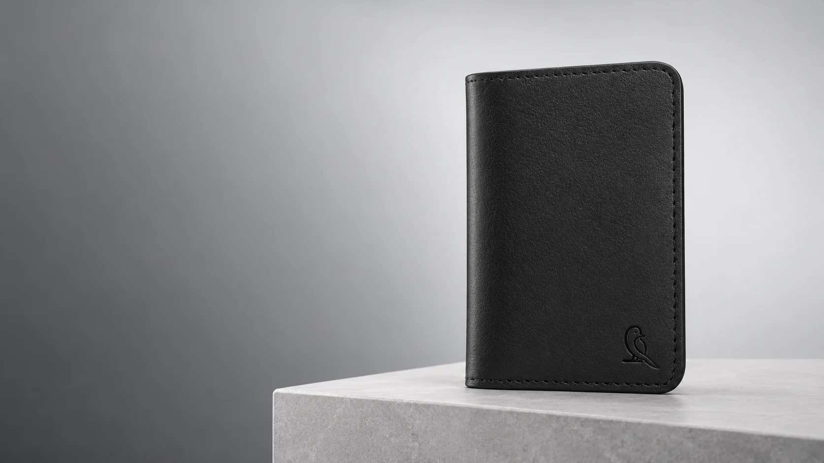 Nirvana black leather Magnetic Majestic Case on a pale stone plinth
